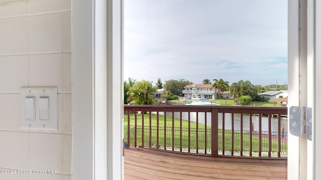 balcony featuring a water view