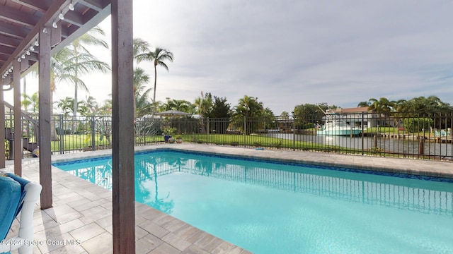 view of swimming pool featuring a patio area