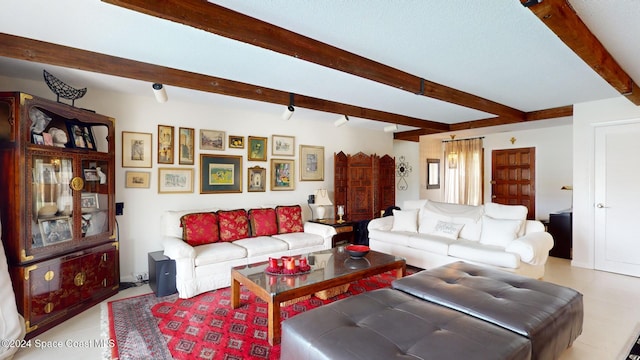 tiled living room featuring beamed ceiling