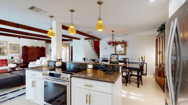 kitchen with white cabinetry, stainless steel appliances, beamed ceiling, dark stone countertops, and pendant lighting