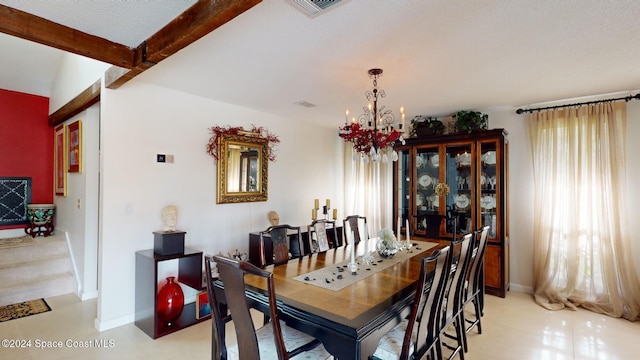 dining room with beamed ceiling, a textured ceiling, and a notable chandelier