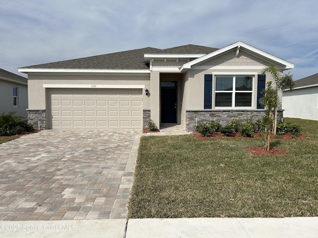 view of front of property with a garage and a front yard