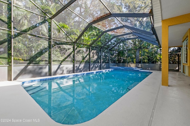 view of pool featuring a lanai and a patio area