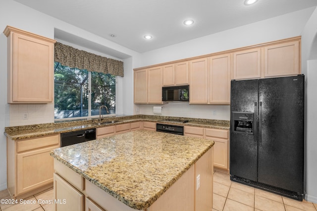 kitchen with sink, black appliances, light brown cabinetry, light stone countertops, and a kitchen island