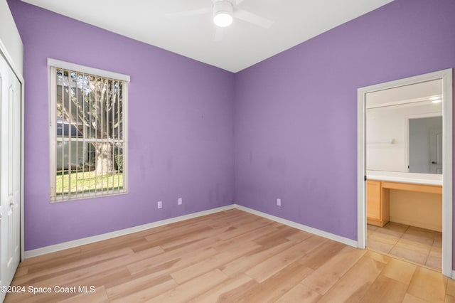 unfurnished bedroom with a closet, ceiling fan, and light hardwood / wood-style floors