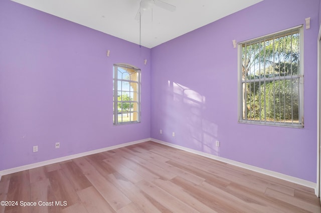 unfurnished room with light hardwood / wood-style floors and ceiling fan