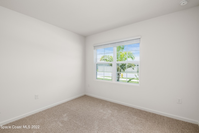 empty room featuring carpet flooring