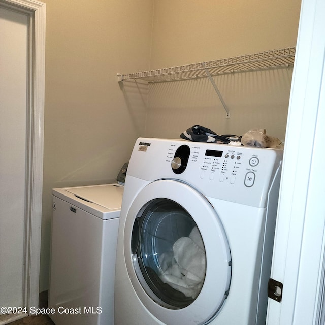 laundry room featuring separate washer and dryer