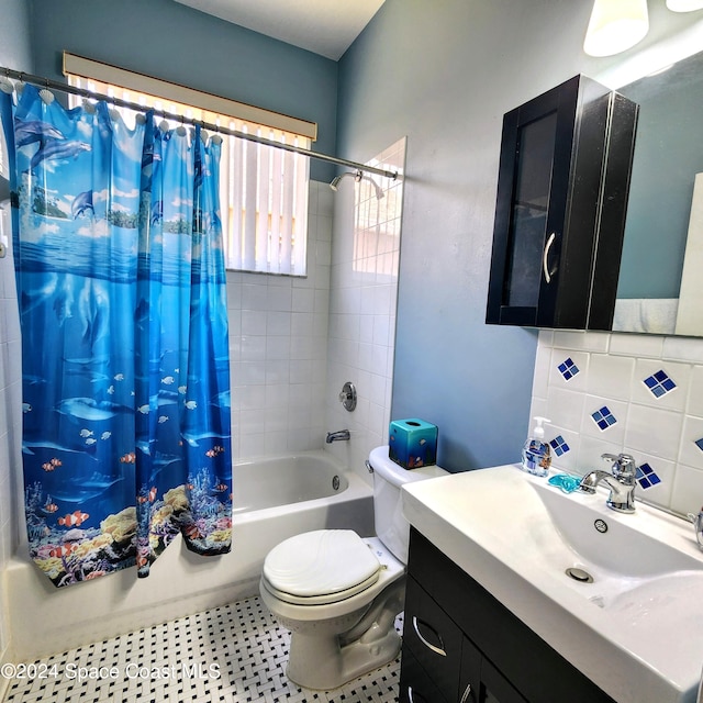 full bathroom featuring vanity, toilet, and shower / bath combo with shower curtain