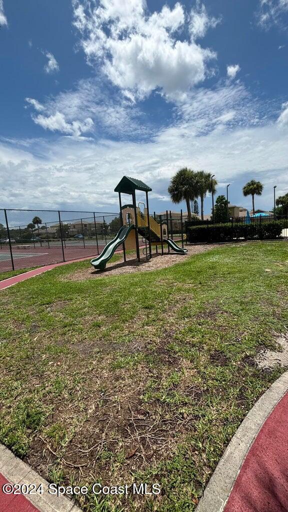 view of playground with a yard