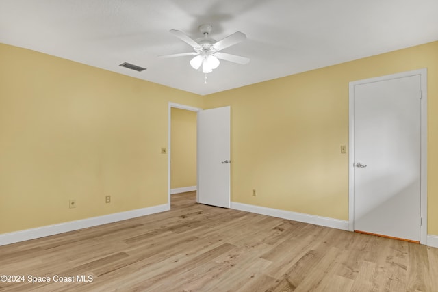 unfurnished room featuring ceiling fan and light wood-type flooring