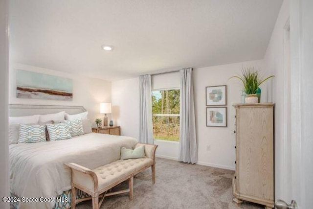 bedroom with light carpet