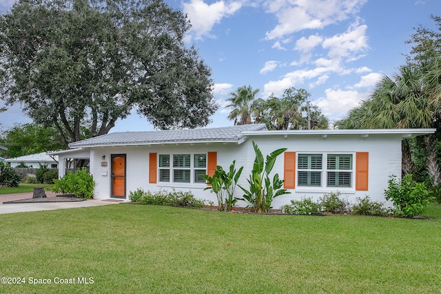 ranch-style house with a front lawn