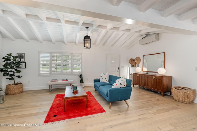 living room with vaulted ceiling with beams, light hardwood / wood-style floors, and an AC wall unit