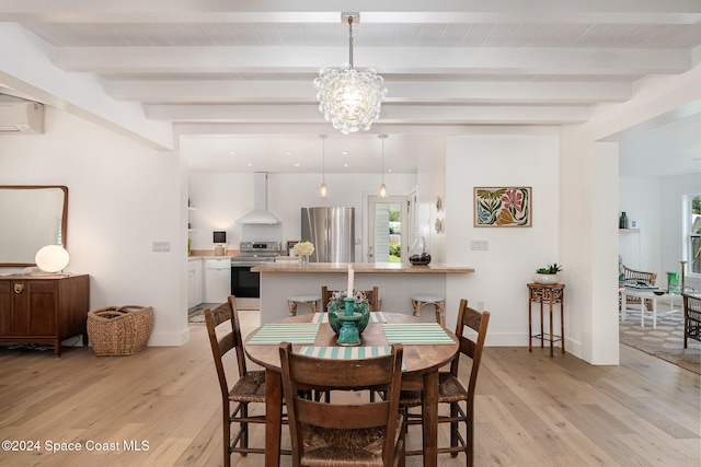 dining area featuring a wall mounted air conditioner, beam ceiling, and light wood-type flooring