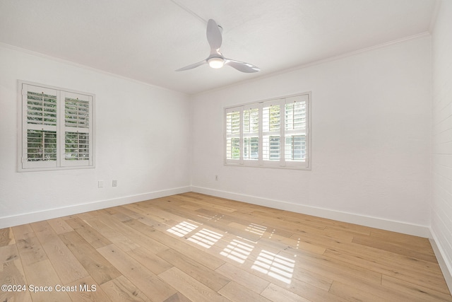 unfurnished room with ceiling fan, light hardwood / wood-style floors, and crown molding