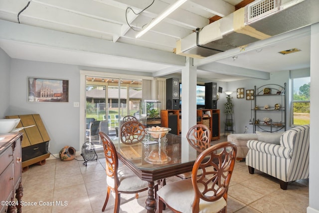 tiled dining space with beamed ceiling