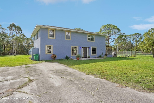 exterior space with a front lawn