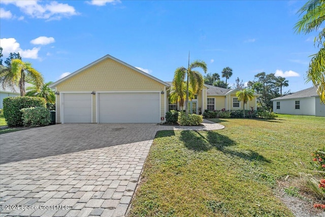 single story home with a garage and a front lawn