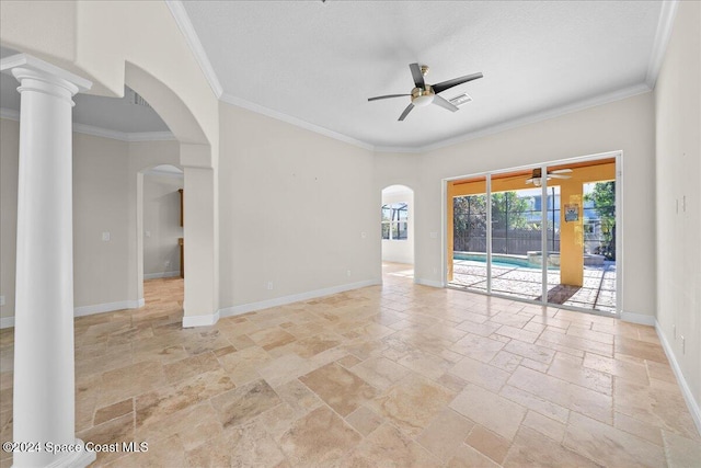 spare room featuring ceiling fan, ornamental molding, and decorative columns