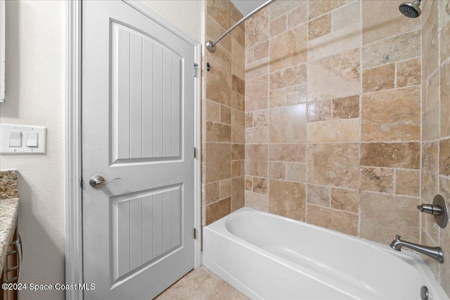 bathroom featuring vanity and tiled shower / bath combo