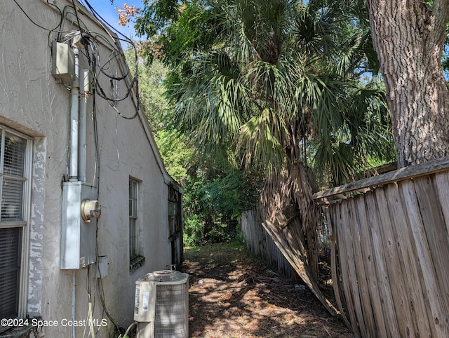 view of side of property featuring cooling unit