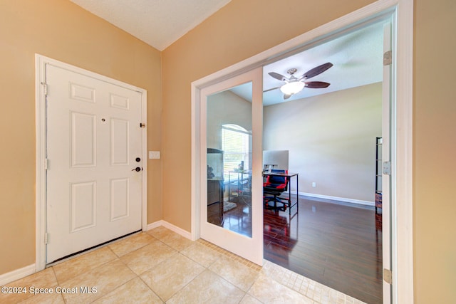 entrance foyer with ceiling fan and light wood-type flooring