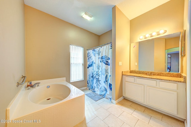 bathroom featuring vanity, tile patterned floors, and shower with separate bathtub