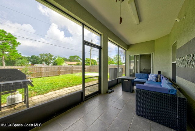 sunroom / solarium with ceiling fan