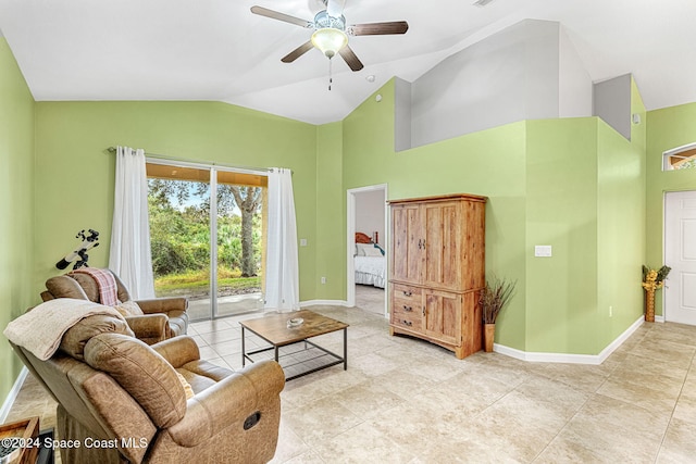 tiled living room featuring ceiling fan and lofted ceiling