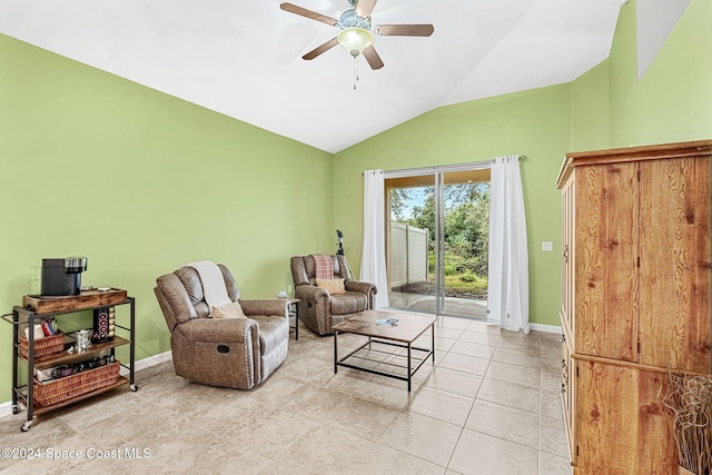 living room featuring vaulted ceiling, ceiling fan, and light tile patterned flooring