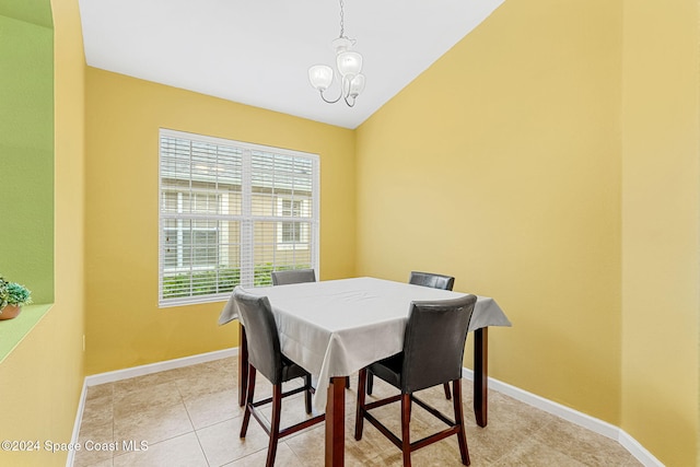 tiled dining area with a notable chandelier