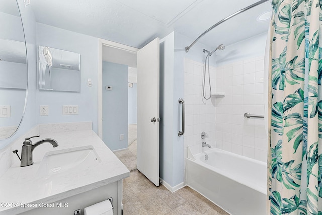 bathroom featuring vanity and shower / bathtub combination with curtain