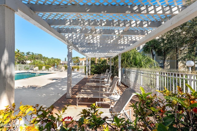 view of patio featuring a pergola and a community pool