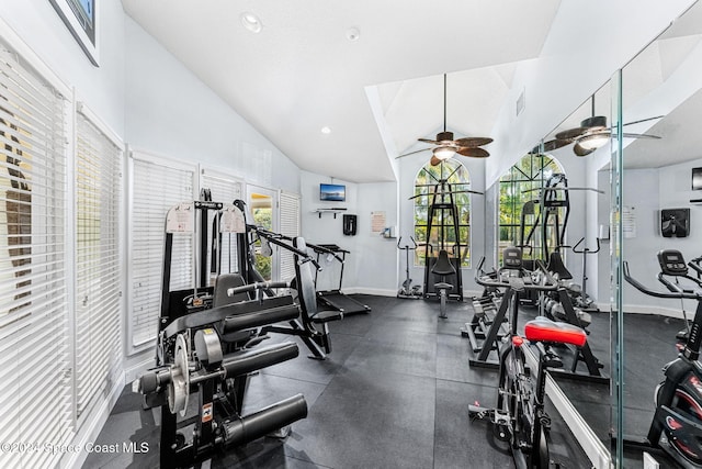 workout area featuring ceiling fan and high vaulted ceiling