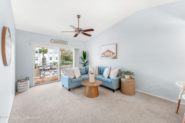 carpeted living room featuring ceiling fan and lofted ceiling