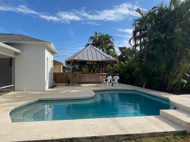 view of swimming pool with a gazebo and a patio