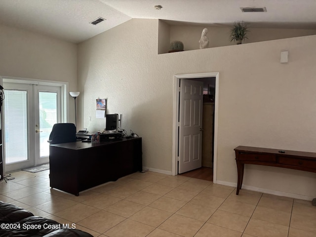 tiled home office with french doors and vaulted ceiling