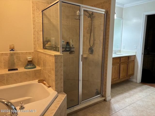 bathroom featuring tile patterned floors, separate shower and tub, vanity, and ornamental molding