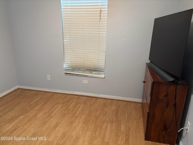 unfurnished bedroom with light wood-type flooring