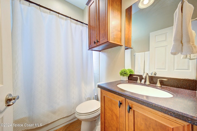 bathroom with vanity and toilet