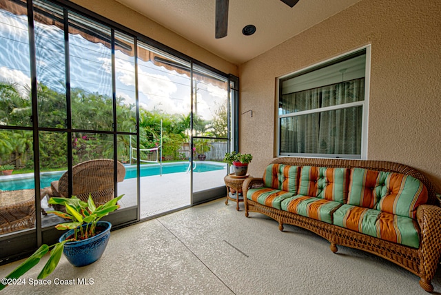 sunroom with ceiling fan