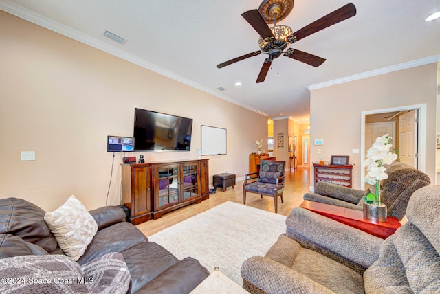 living room with ornamental molding, ceiling fan, and light hardwood / wood-style flooring