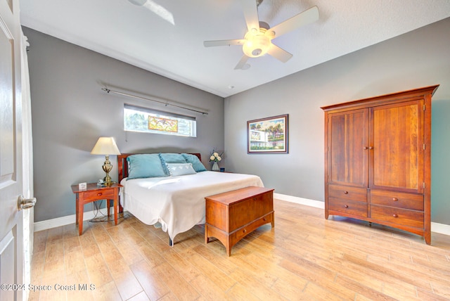 bedroom featuring ceiling fan and light hardwood / wood-style floors