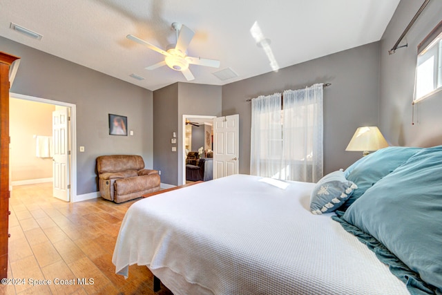 bedroom featuring ceiling fan and light hardwood / wood-style floors