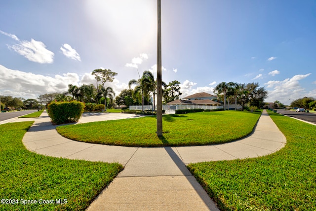 view of community featuring a lawn