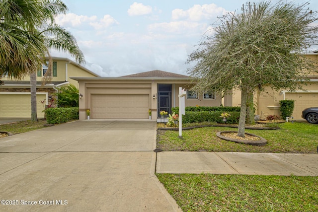 view of front of home with a garage and a front yard