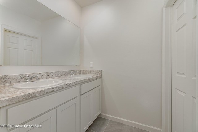 bathroom with tile patterned flooring and vanity