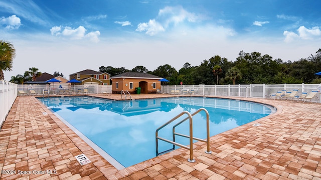 view of pool featuring a patio