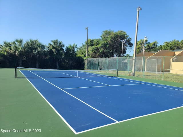 view of tennis court with basketball court